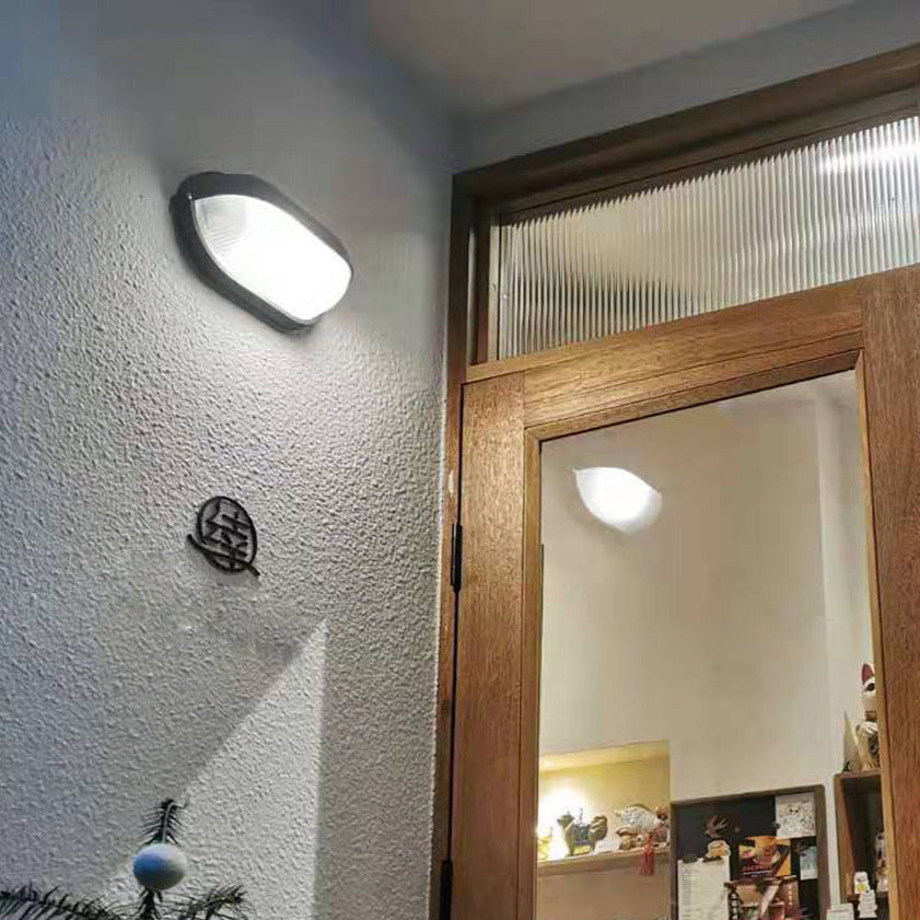Lampada da parete per esterni ovale in vetro rigato nera, stile industriale navale