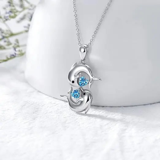 Collana in Argento con Doppi Delfini e Cristallo Blu