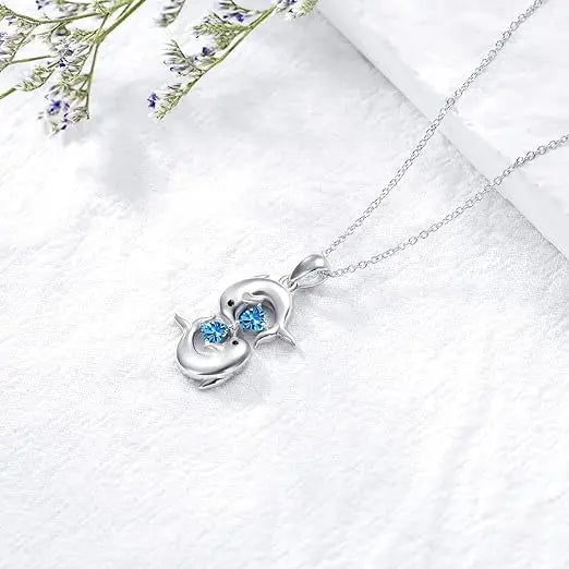 Collana in Argento con Doppi Delfini e Cristallo Blu