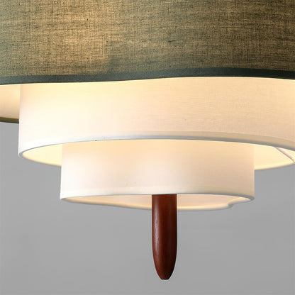 Lampada a sospensione a tamburo in tessuto verde con dettagli in legno, stile scandinavo