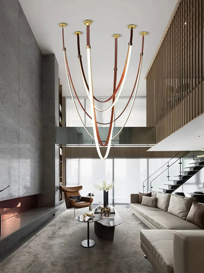 Lampada a sospensione Beza in pelle con LED dimmerabile, design moderno scultoreo