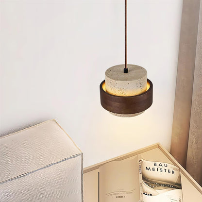 Lampada a sospensione cilindrica in travertino e legno noce japandi