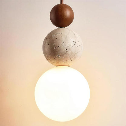 Lampada a sospensione in travertino con globo e sfere sovrapposte