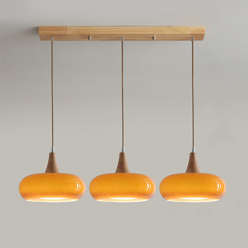 Lampada a sospensione in vetro ambra e legno mid century per isola cucina