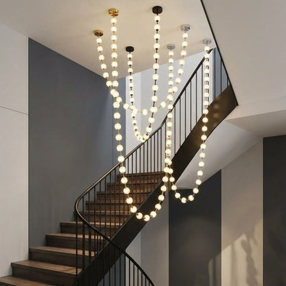 Lampadario moderno Esle a collana di perle in vetro trasparente