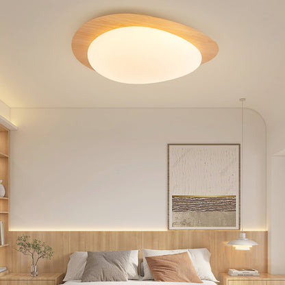 Plafoniera LED japandi a ciottolo con venatura del legno noce