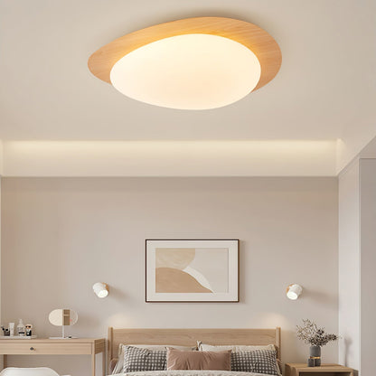 Plafoniera LED japandi a ciottolo con venatura del legno noce