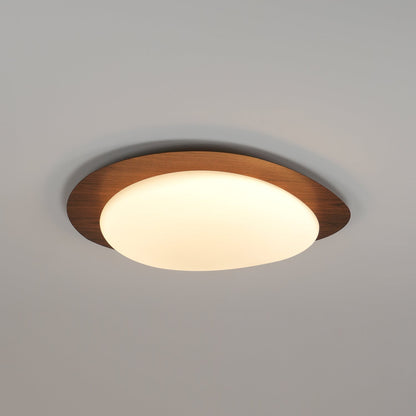 Plafoniera LED japandi a ciottolo con venatura del legno noce